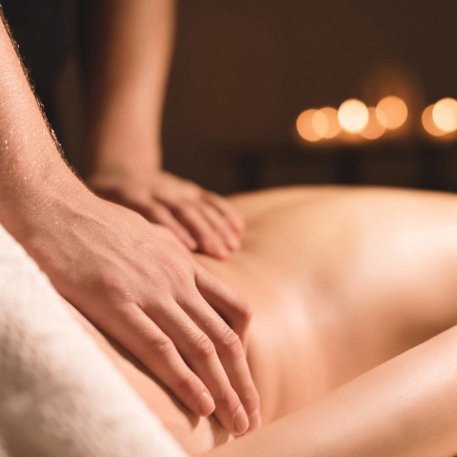 An R Spa member receiving a massage as part of their membership