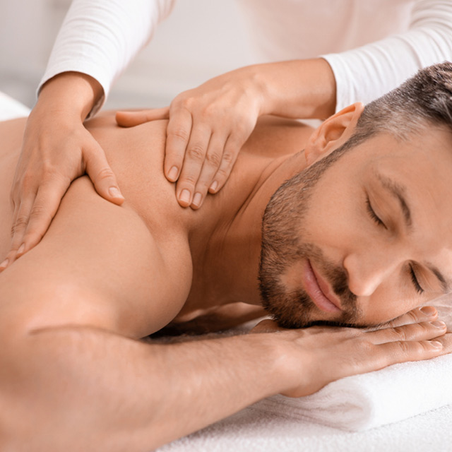 A man enjoying a relaxing massage at R Spa