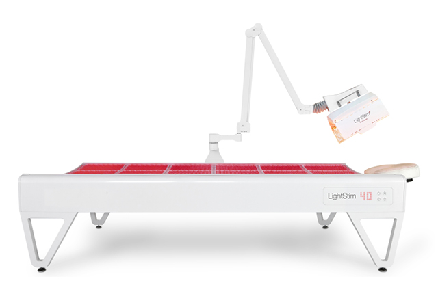 A woman enjoying a Red Light Therapy by LightStim full-body session